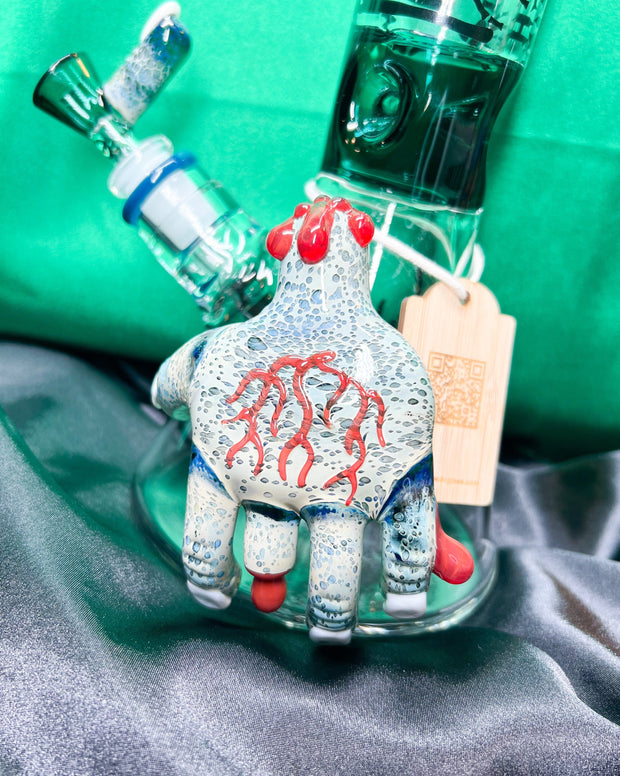 a closeup of a zombie hand on a bong